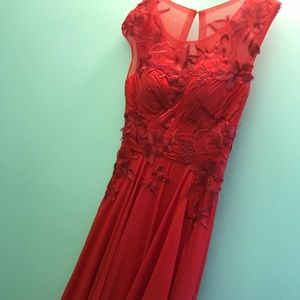 Red floor length formal dress with appliqués